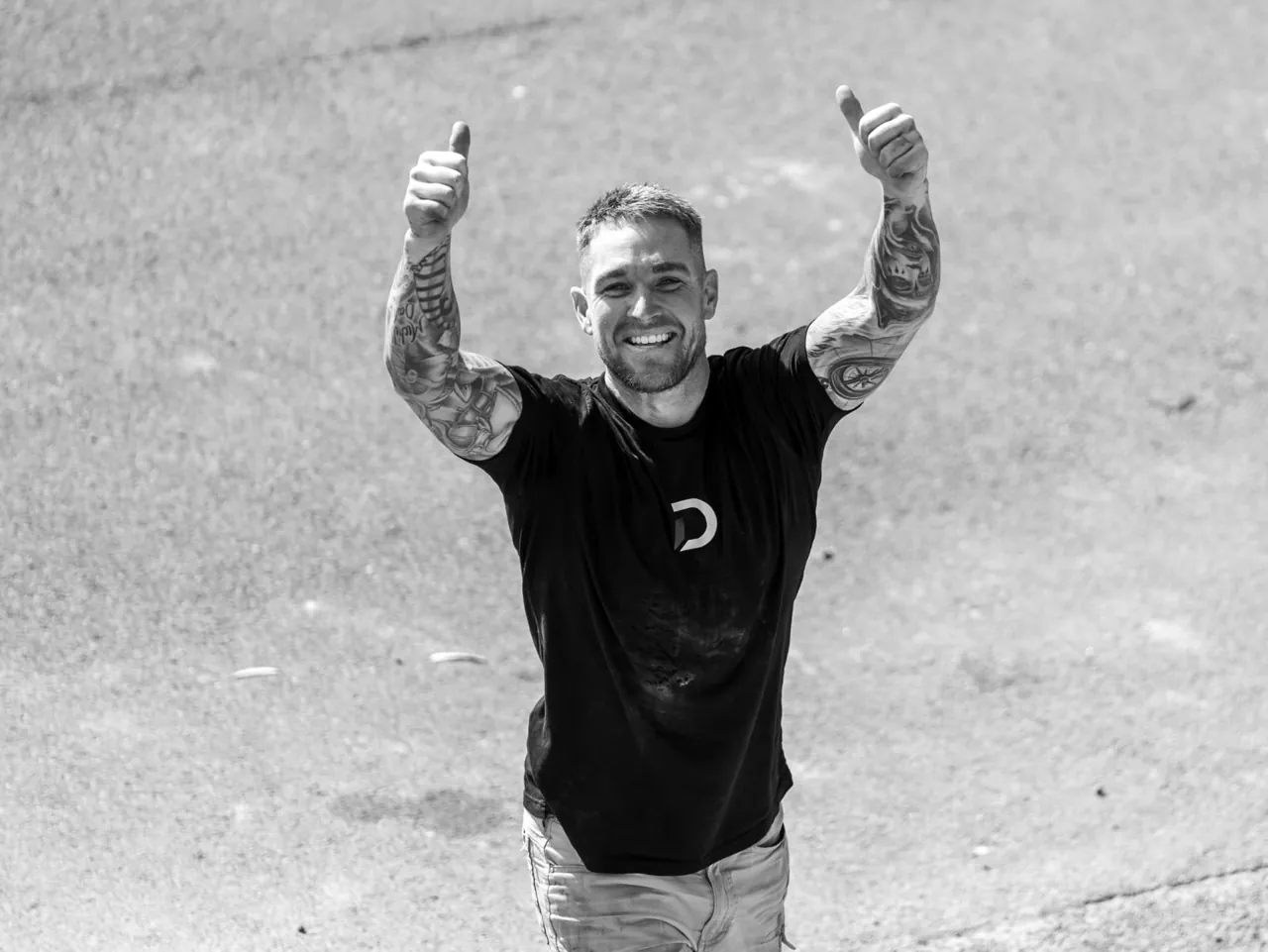 Jye, owner of Desired Concrete & Landscapes, giving two thumbs up